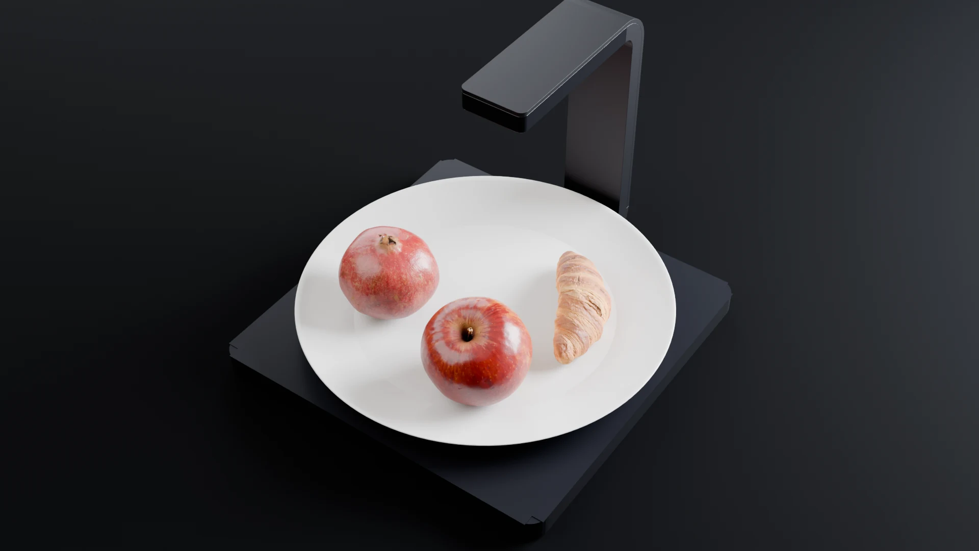 The Calori Scale in space black with an apple, a pomegranate and a croissant on a plate